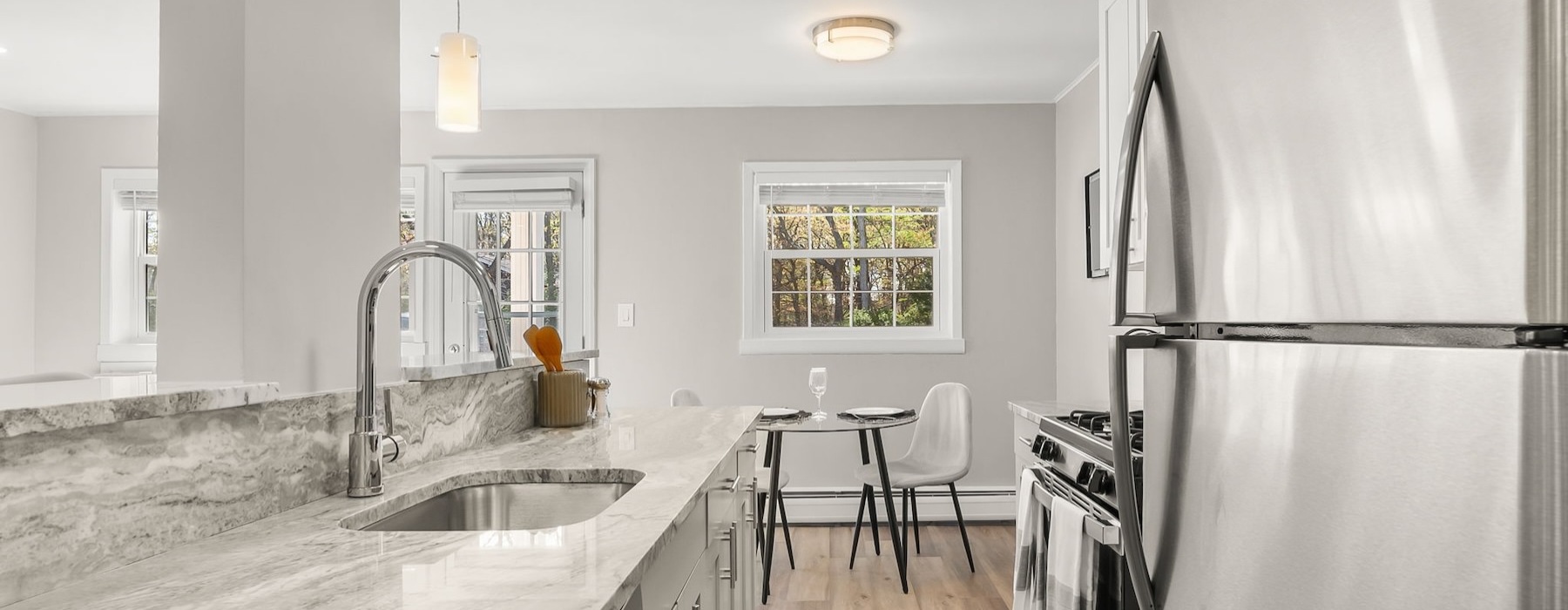a kitchen with a marble countertop